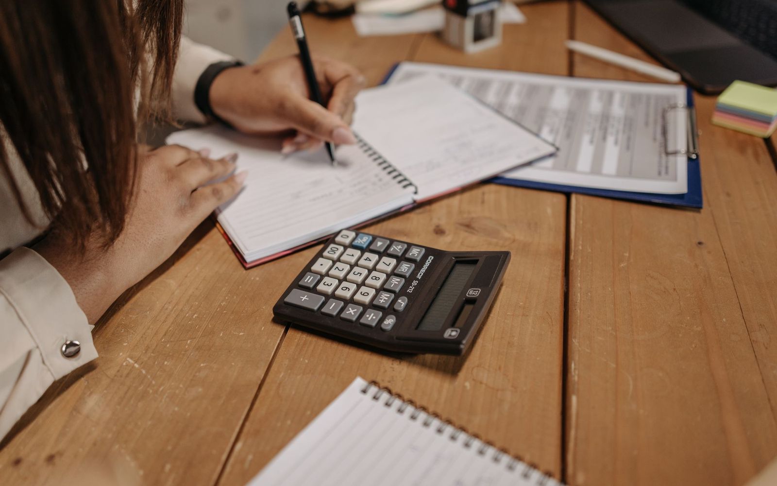 Two people going through paperwork together at a desk