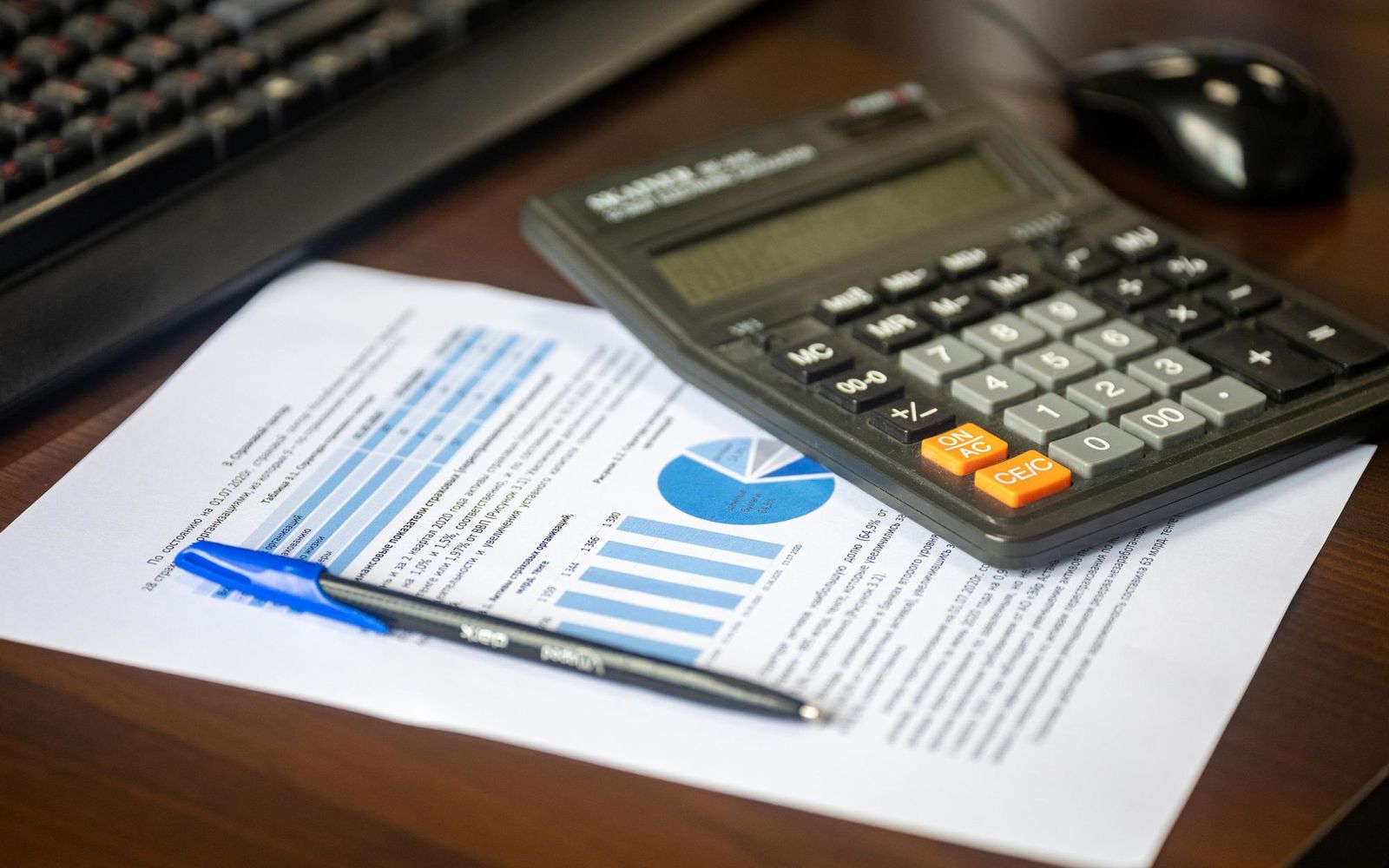 Notes and figures spread across an advisory desk