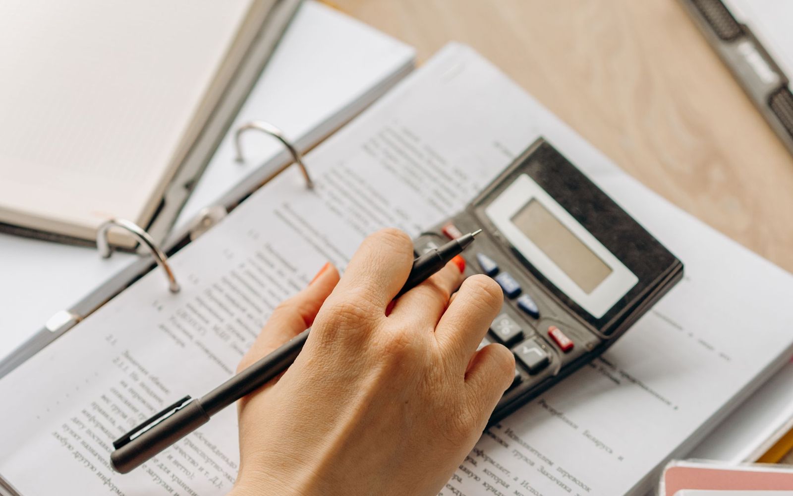 A founder recording content at a desk with a product