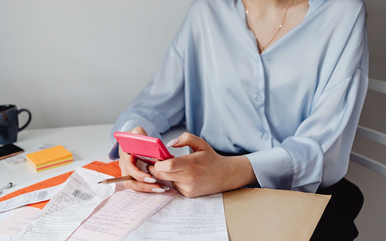 Loan documents and a pen on an adviser's desk