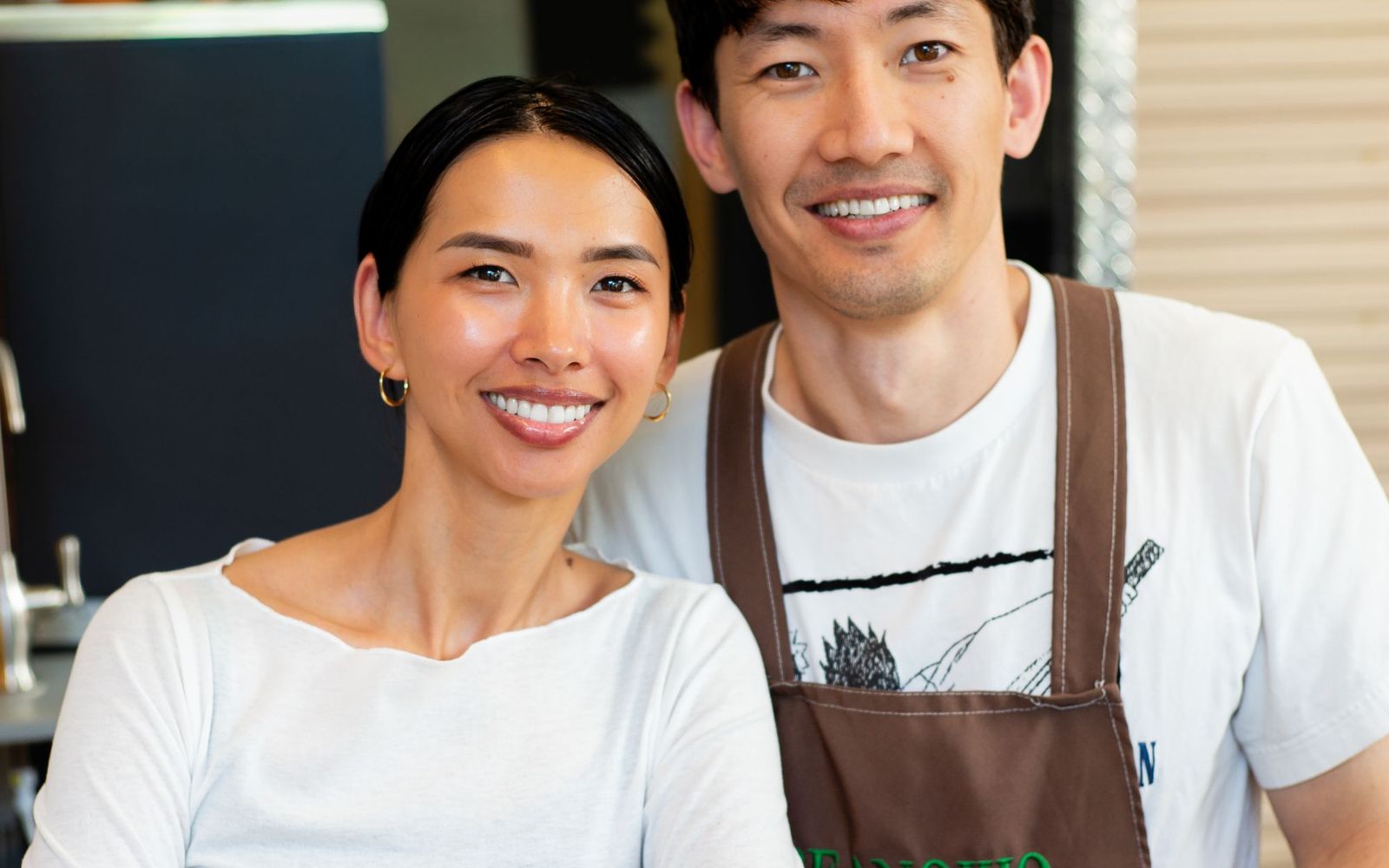 Staff working behind the counter of a busy cafe