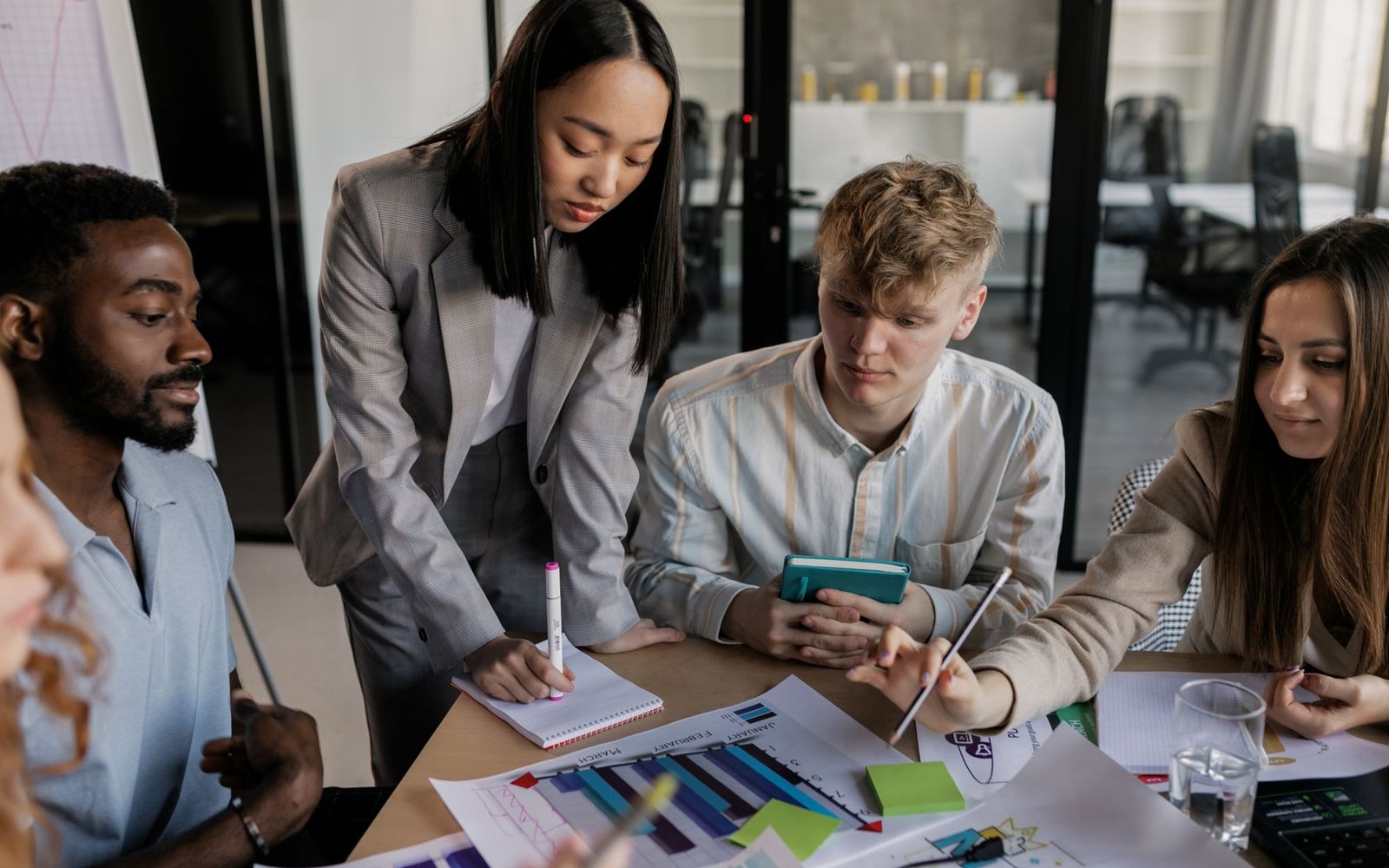 Two people in a small business meeting reviewing notes