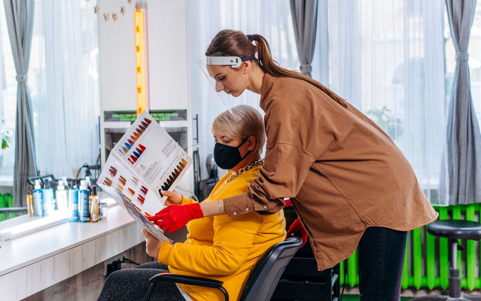 Two staff members working behind a counter