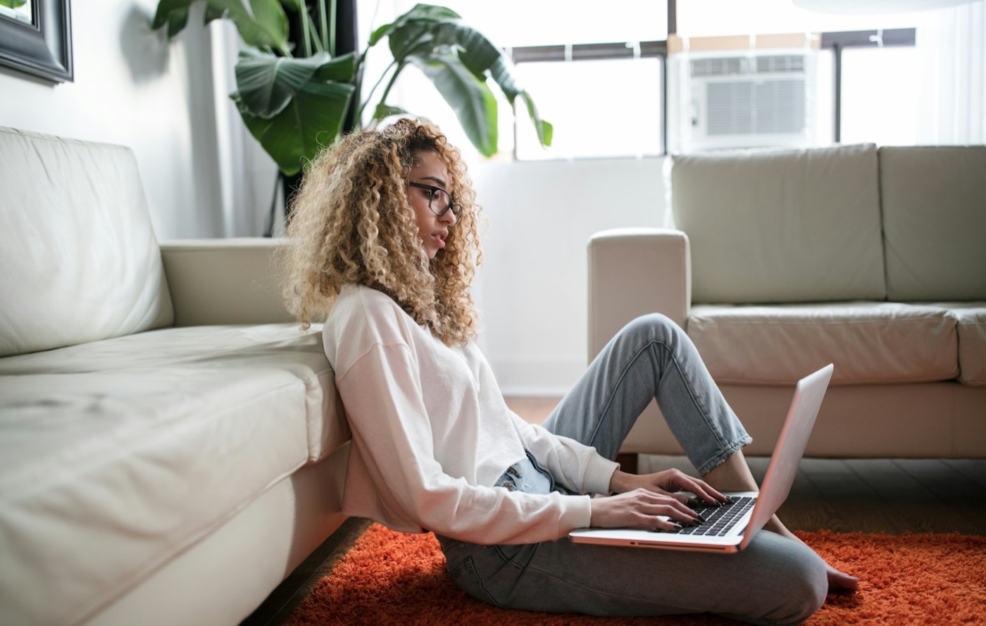 A woman working on a laptop at home