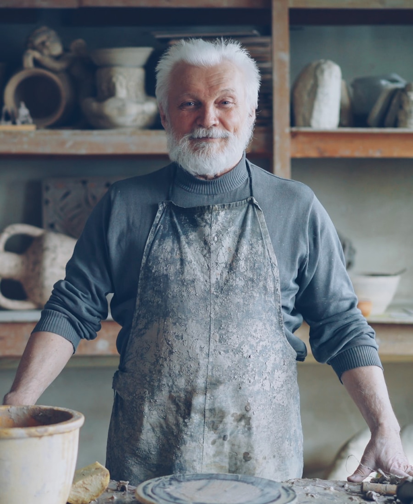 A craftsman standing in his workshop