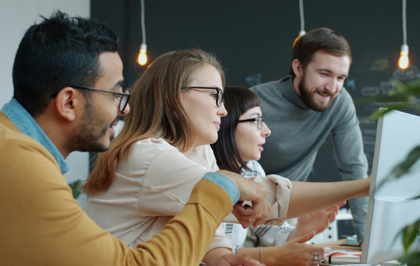 A young team collaborating around a desk